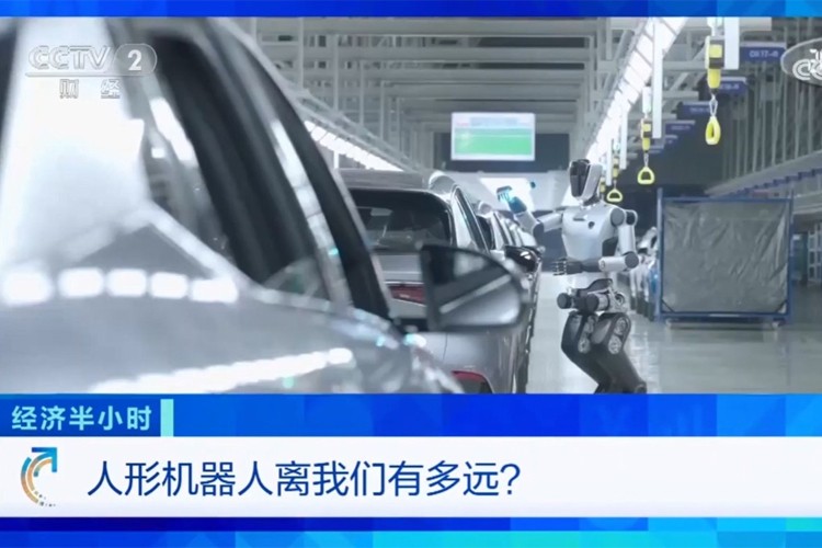 中央电视台《经济半小时》栏目对pg电子直营机器人的专题报道